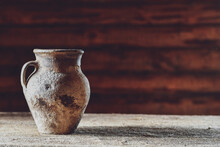 Old Antique Jug On Rustic Wooden Background. Copy Space.  Low DOF.