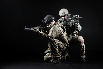 Wall Mural - American special forces, two soldiers in military uniform with weapons attack, elite troops on special missions, counter-terrorist