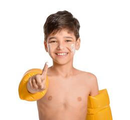 Wall Mural - Little boy with sun protection cream on his face against white background