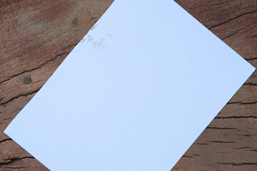 top view white paper on old wood background and space for text