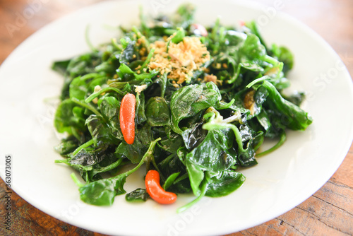 Stir fried oyster sauce watercress vegetable on white plate - Health food green vegetables cooked food in thailand