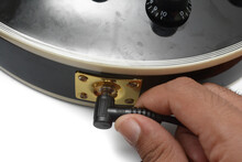 Close Up A Man Hand Is Plug In The Guitar Cable Into The Guitar Jack Socket.