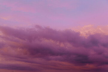 Wall Mural - beautiful sky with pink clouds in sky at sunset . natural background.