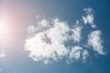 Wall Mural - blue sky with white clouds and sun. beautiful natural background.