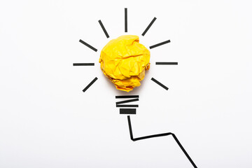 Inspiration concept crumpled color paper light bulb metaphor for good idea