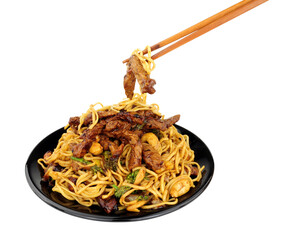 Wall Mural - Beef in black bean sauce with egg noodles and cashew nuts meal with wood chopsticks isolated on a white background