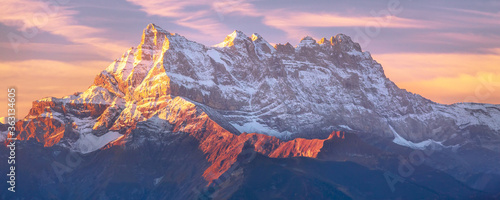 Fotografía Sinrise or sunset panoramic banner view of the Dents du Midi in the Swiss Alps,