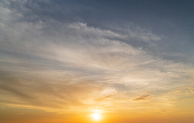 Wall Mural - abstract amazing scene of stuning colorful sunset with moving clouds background in nature and travel