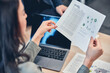 © Viacheslav Yakobchuk - Female hand holding document of global market energy research