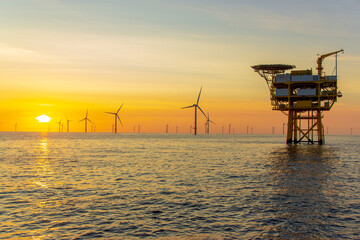 beautiful sunset at the north sea offshore wind farm