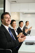 © ImageHit - Business people clapping hands at meeting