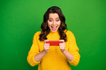 Sticker - Portrait of surprised crazy girl use smartphone browse internet impressed by fast speed connection scream wow omg wear jumper isolated over bright shine color background