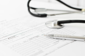 Filling medical form, document and stethoscope