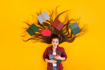 Canvas Print - Top view above high angle flat lay flatlay lie concept of nice minded pensive long-haired girl reading book creating plan pondering isolated on bright vivid shine vibrant yellow color background