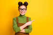 © deagreez - Portrait of positive cheerful girl point index finger copyspace present adverts promo recommend suggest select wear jumper overall isolated over bright shine color background