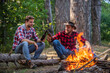 © be free - a meeting place. hiking adventure. picnic in tourism camp. happy men brothers. friends relaxing in park together. drink beer at picnic. campfire life story. spend free time together. family camping