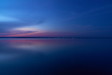 beautiful clouds during blue hour over the lake
