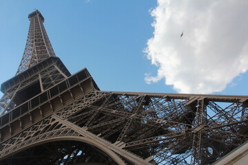 The iconic Eiffel Tower of Paris (wrought-iron lattice tower) against clear blue skies