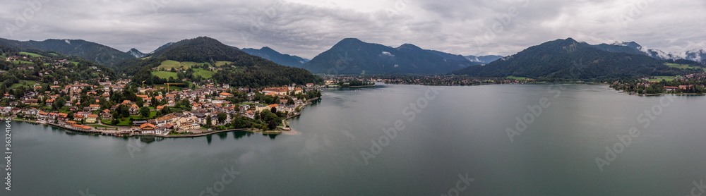 Drone Shot Over Tegernsee Outside Munich Showing Lake And Mountains. - obrazy, fototapety, plakaty 
