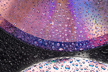 Wall Mural - water drops on dvd media, water drops on colorful background