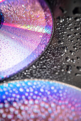 Wall Mural - water drops on dvd media, water drops on colorful background