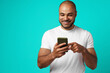© fotofabrika - Young african american man making video call with his smartphone