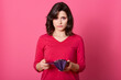 © sementsova321 - Very sad adult girl with empty purse looking directly at camera, no money left after shopping, has financial problems, has no cash female being in bad mood.