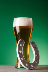 Sticker - St Patrick's Day beer and lucky horseshoe against a green background