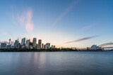 Fototapeta  - Sydney downtown skyline during sunset at Sydney harbor bay, NSW, Australia