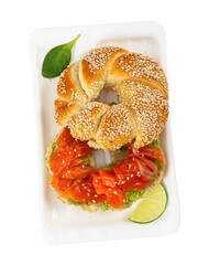 Sliced salmon with avocado on bagel with sesame seeds isolated on white background. Top view. Perfect healthy breakfast.