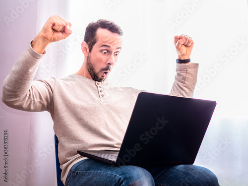 Fotomural Man with his arms up for having had some achievement at work or for having won t