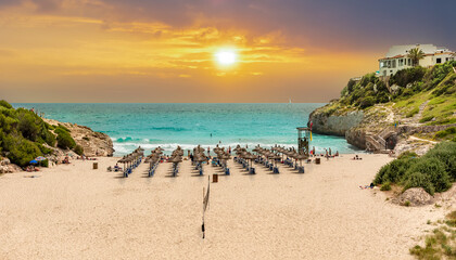 Wall Mural - Beautiful vibrant sunrise on the tropical beach on Cala Domingos playa de Mallorca in the summer holiday, Spain