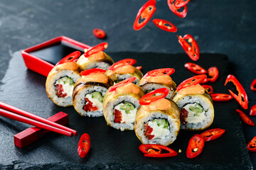 Wall Mural - spicy sushi with eggplant and chili pepper