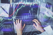 © peshkova - Double exposure of woman hands typing on computer and forex chart hologram drawing. Stock market invest concept.