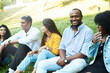 © etonastenka - Group of happy friends having fun at barbecue party outdoor in house backyard. Young diverse culture people and friendship concept