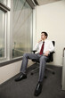 © ImageHit - Businessman contemplating while looking at the view from his room