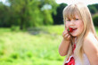 © ImageHit - Girl eating a strawberry