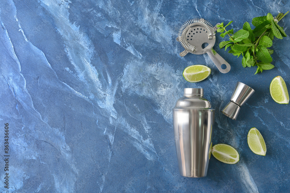 Shaker and ingredients for fresh mojito on color background