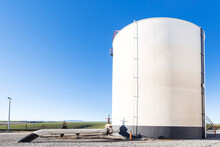 Oil Storage Tank Farm In The Petroleum Refinery. Above Ground Storage Tanks Can Be Used To Hold Materials Such As Petroleum, Waste Matter, Water, Chemicals, And Other Hazardous Materials.