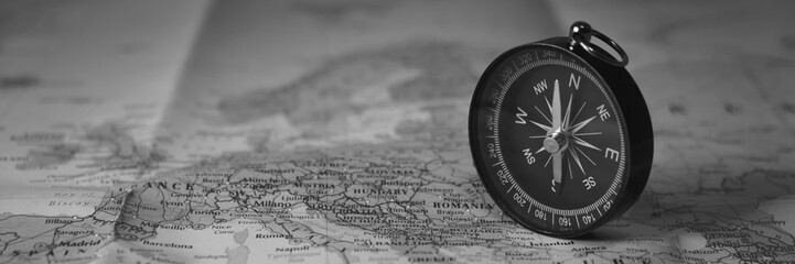 ompass on the tourist map. focus on the compass needle