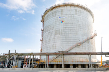 View of the large double walled ammonia tank and pipeline in chemical plant.