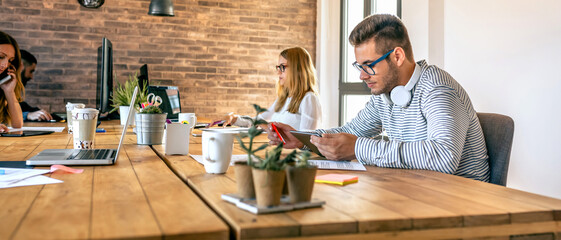 Wall Mural - Businessman working in a coworking office