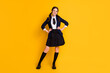 Full length body size view of her she nice attractive pretty cheerful cheery content schoolgirl posing wearing jacket isolated on bright vivid shine vibrant yellow color background