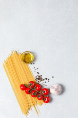 Wall Mural - Ingredients for cooking traditional Italian pasta on white grey background