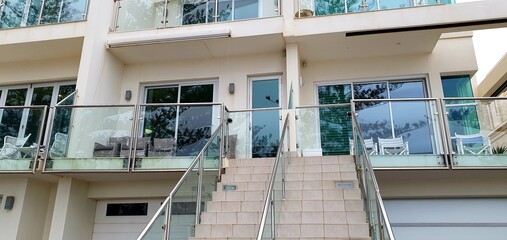 Sticker - Panoramic shot of a staircase leading to a white building