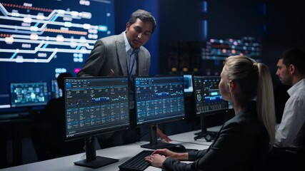 Wall Mural - Confident Female Specialist Works on Computer Talks with Team Leader in Big Infrastructure Control Room. Business Woman Professional Uses Computer Showing Charts, Information. Monitoring Room Teamwork