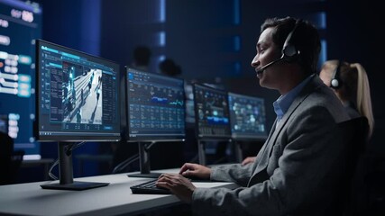 Aufkleber - Confident Male Cyber Security Data Scientist Works on Personal Computer Showing Surveillance Tracking Footage of People Walking on City Streets. Big Monitoring Room with Professional People Working