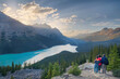 © romylee - a family of hikers observing sunset over Peyto lake in Canada