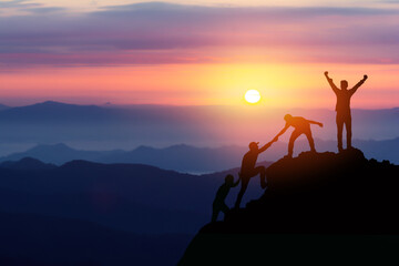 teamwork friendship hiking help each other trust assistance silhouette in mountains, sunrise. teamwo