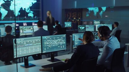 Fototapete - Team of Professional Computer Data Science Engineers Work on Desktops with Screens Showing Charts, Graphs, Infographics, Technical Business Data and Statistics. Low Key Control and Monitoring Room.